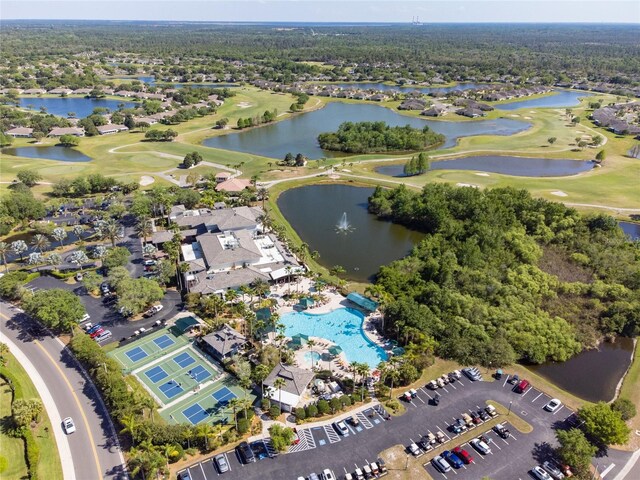 1257 Corinth Greens Dr Unit 1257, Sun City Center, FL 33573 - aerial perspective of suburban area with a golf course, a nearby body of water, and a pool