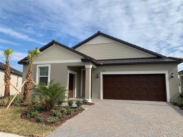 view of front of home with a garage