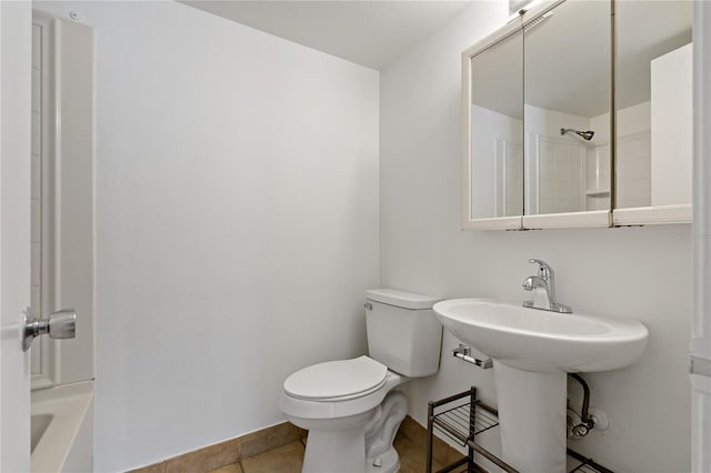 bathroom featuring tile patterned floors and toilet