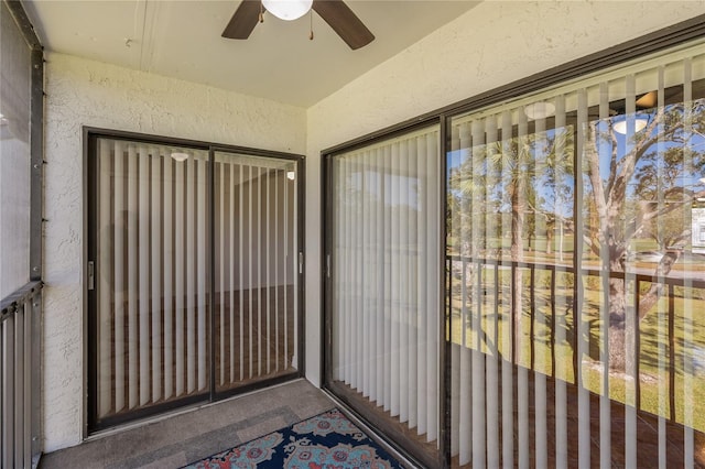 sunroom featuring ceiling fan