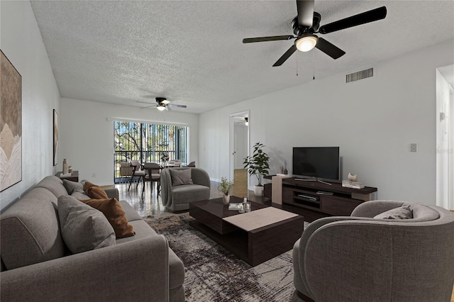 122 E Cypress Ct Unit 22, Oldsmar, FL 34677 - living room with wood finished floors, ceiling fan, baseboards, visible vents, and a textured ceiling