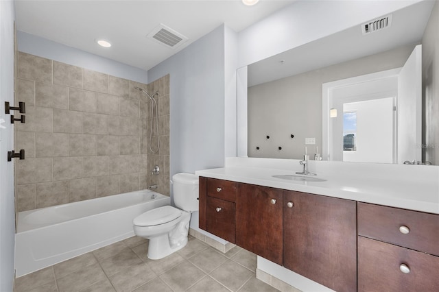 full bathroom with tile patterned flooring, vanity, toilet, and tiled shower / bath