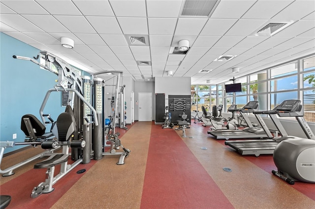 gym featuring a drop ceiling