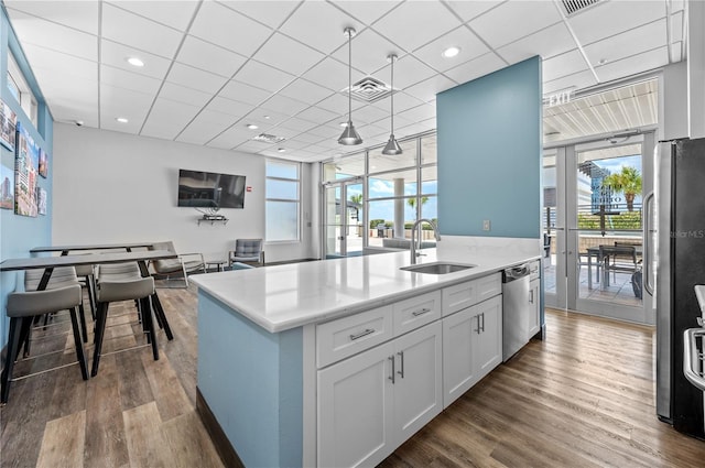 kitchen featuring white cabinets, dark hardwood / wood-style flooring, stainless steel appliances, and sink