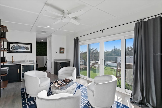 living room featuring coffered ceiling, wine cooler, indoor bar, dark hardwood / wood-style floors, and ceiling fan