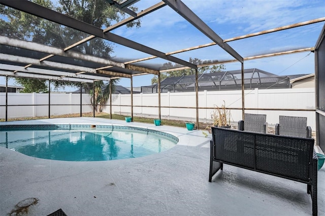 view of pool featuring a lanai and a patio