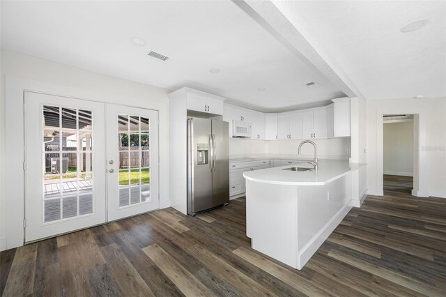 kitchen featuring sink, white cabinets, kitchen peninsula, stainless steel refrigerator with ice dispenser, and french doors