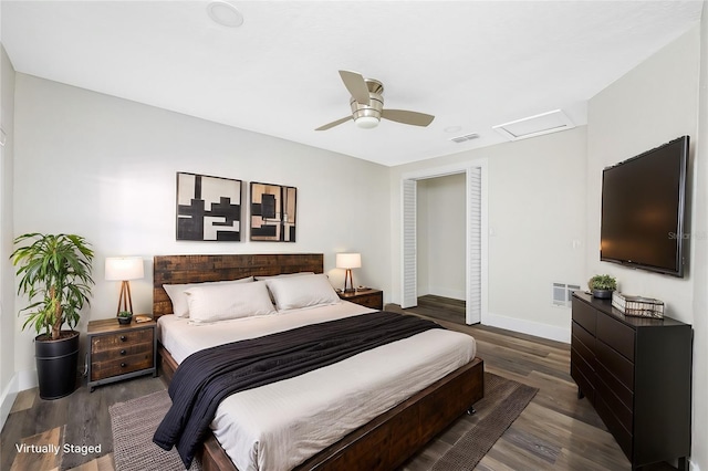 bedroom with dark wood-type flooring and ceiling fan