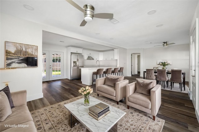 living room with french doors, ceiling fan, dark hardwood / wood-style floors, and sink