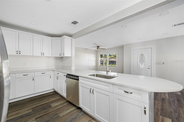 kitchen with sink, white cabinets, and kitchen peninsula