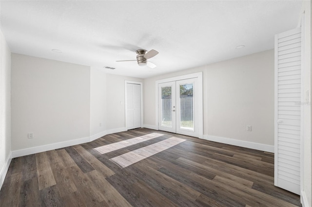 unfurnished room with ceiling fan, dark hardwood / wood-style flooring, and french doors