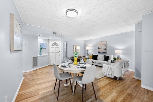 dining space featuring hardwood / wood-style flooring