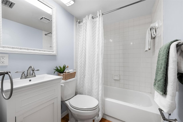 full bathroom with vanity, toilet, and shower / bath combo