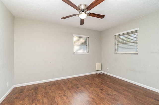 spare room featuring a textured ceiling, hardwood / wood-style flooring, and ceiling fan