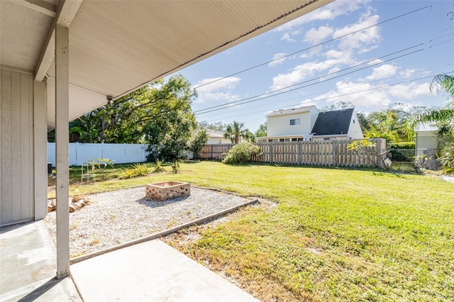 view of yard featuring a patio area and a fire pit