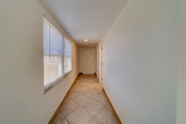 hallway featuring light tile patterned flooring