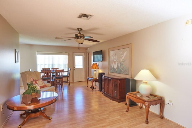 interior space featuring light wood-type flooring and ceiling fan