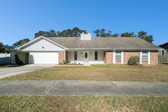 ranch-style home with a front yard and a garage