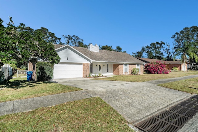 ranch-style house with a garage and a front lawn