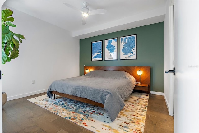 bedroom featuring ceiling fan and hardwood / wood-style floors