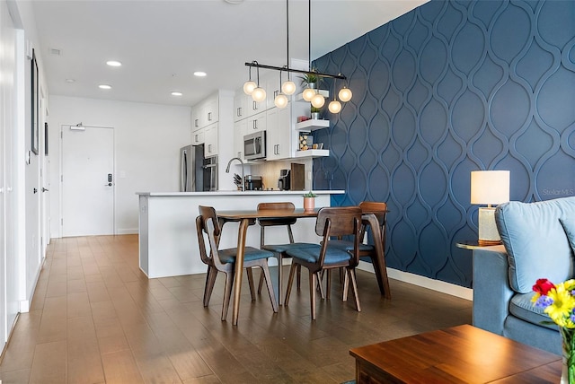 dining area featuring dark hardwood / wood-style flooring