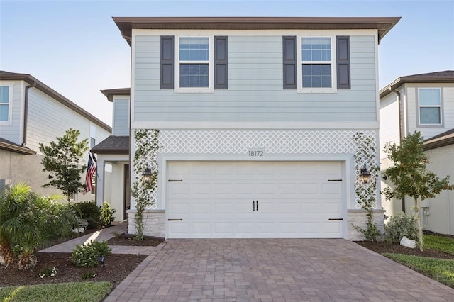 view of front of property with a garage