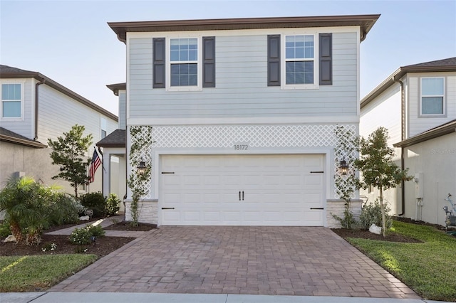 view of front of property with a garage