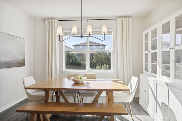 dining space with hardwood / wood-style flooring