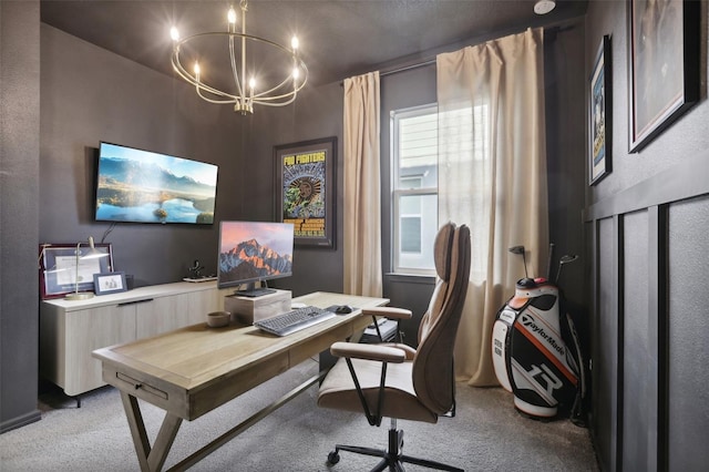 office area with light carpet and an inviting chandelier