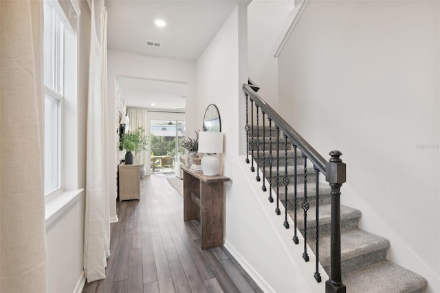 stairs featuring hardwood / wood-style flooring