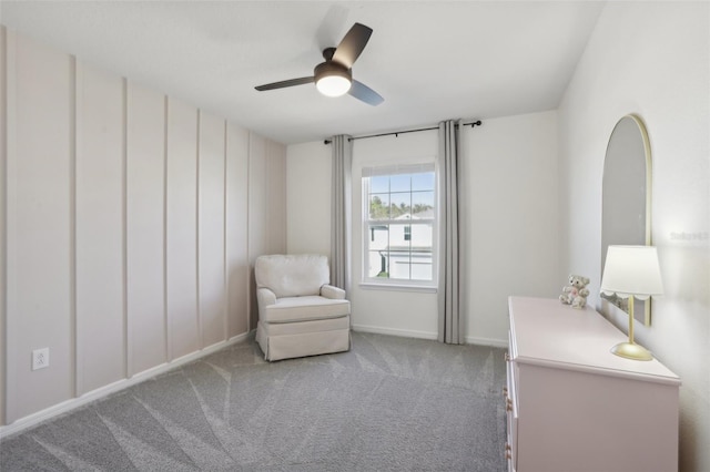 unfurnished room featuring ceiling fan and light colored carpet