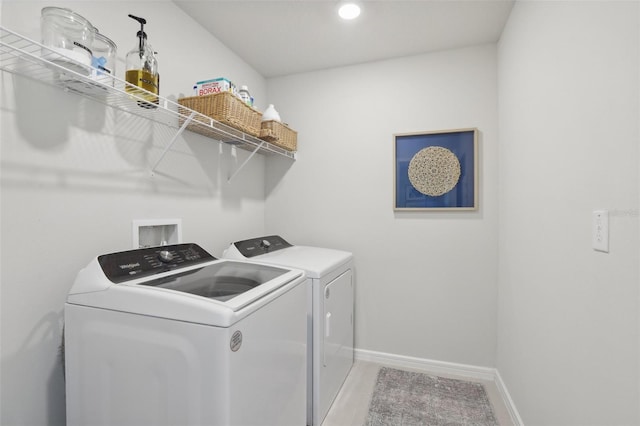 clothes washing area featuring washing machine and dryer