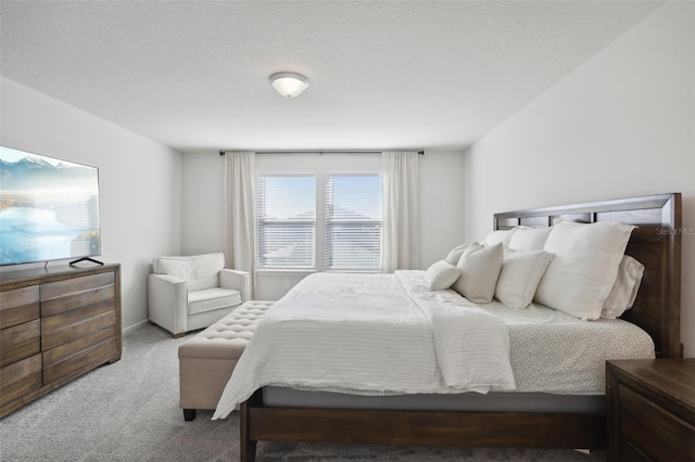 carpeted bedroom with a textured ceiling