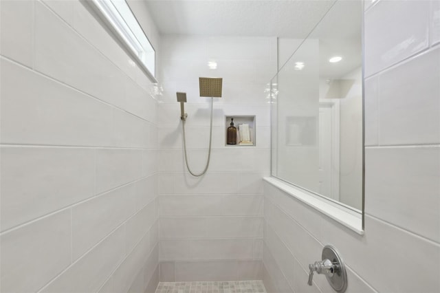 bathroom with a tile shower