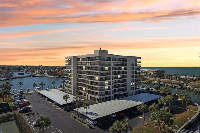 outdoor building at dusk featuring a water view