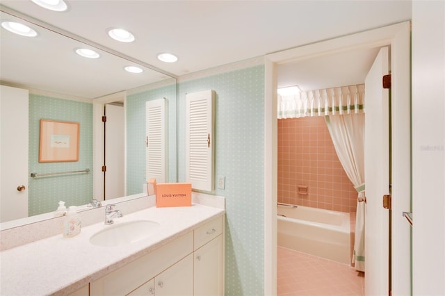 bathroom featuring tile patterned floors, vanity, and tiled shower / bath