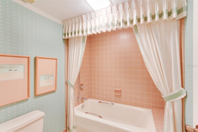 bathroom with toilet and shower / tub combo with curtain