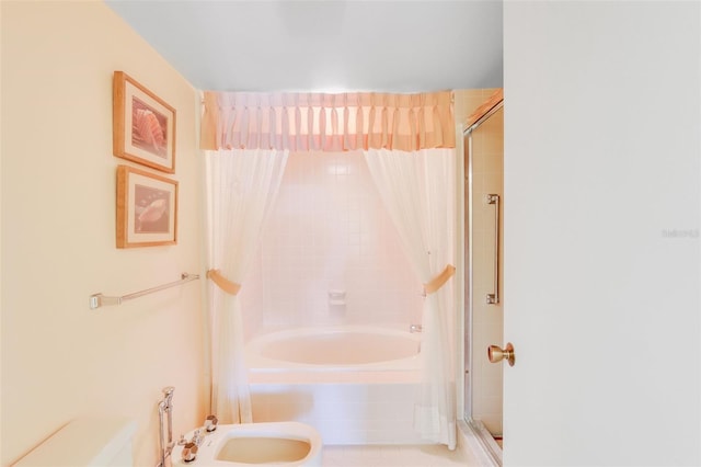 bathroom with tile patterned floors, a bidet, and independent shower and bath