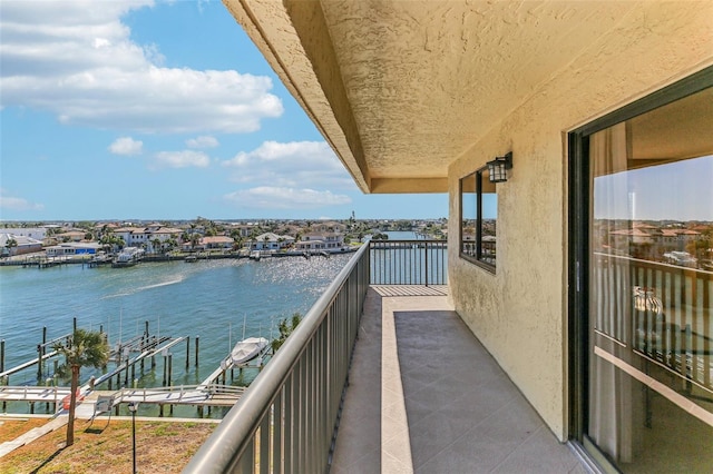 balcony featuring a water view