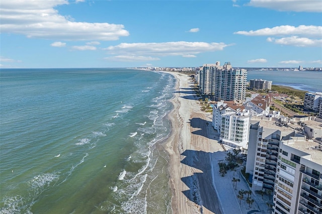 bird's eye view featuring a water view and a beach view