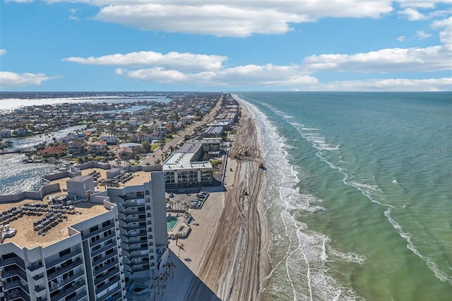 birds eye view of property with a view of the beach and a water view