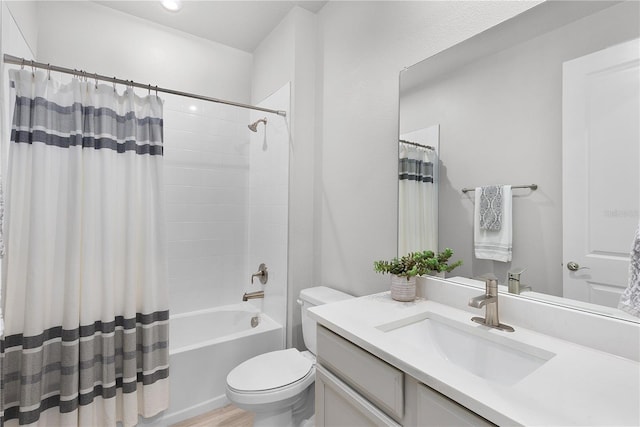 full bathroom with hardwood / wood-style floors, vanity, toilet, and shower / bath combo