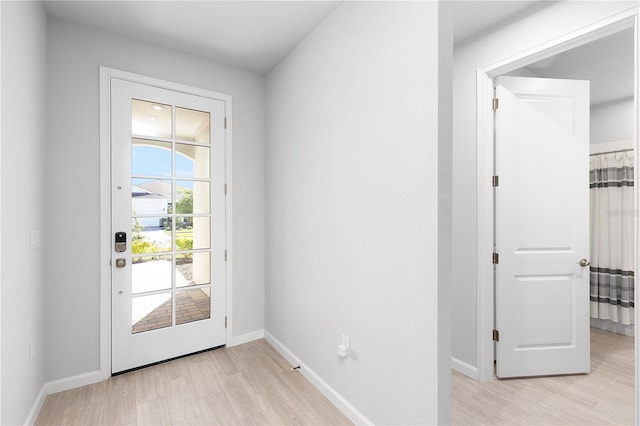 doorway to outside with light hardwood / wood-style flooring