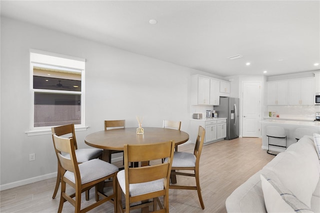 dining space featuring light hardwood / wood-style floors