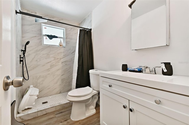 bathroom with a shower with curtain, vanity, toilet, and wood-type flooring