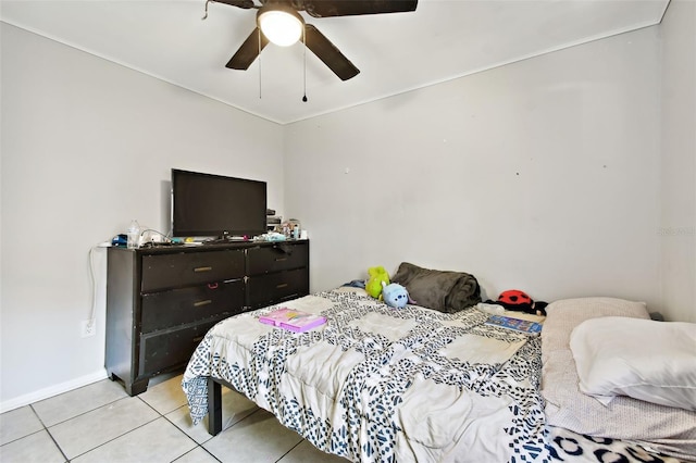 tiled bedroom with ceiling fan