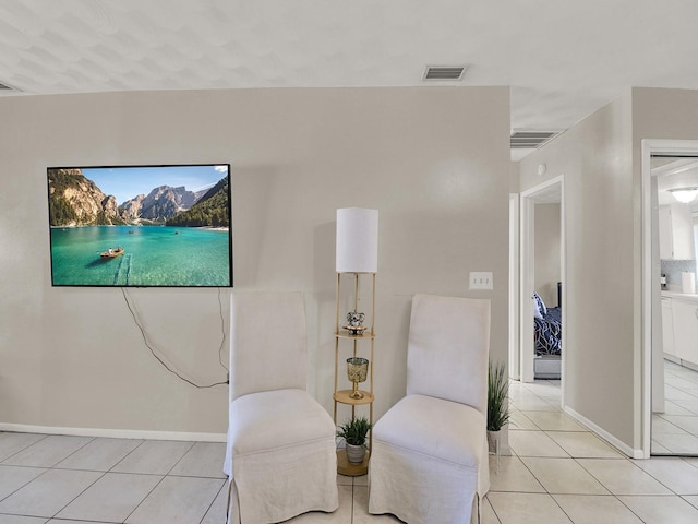 sitting room with light tile patterned floors