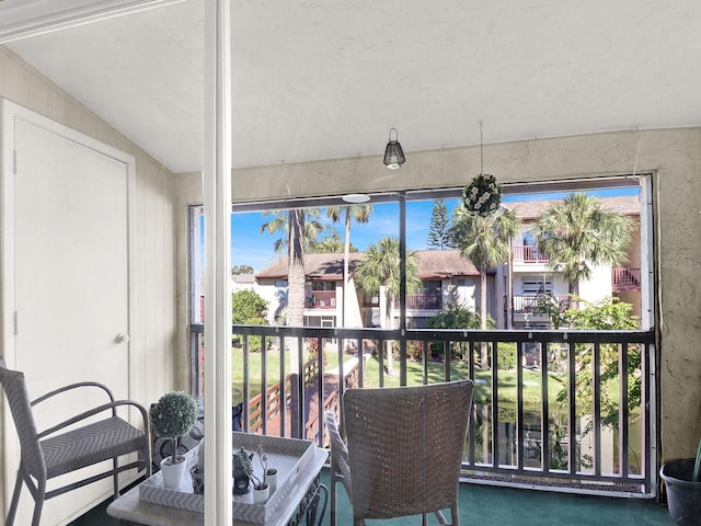 sunroom / solarium with lofted ceiling