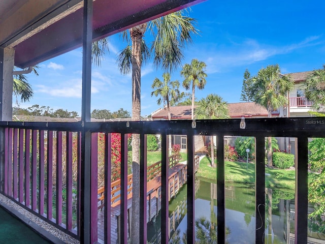 balcony featuring a water view