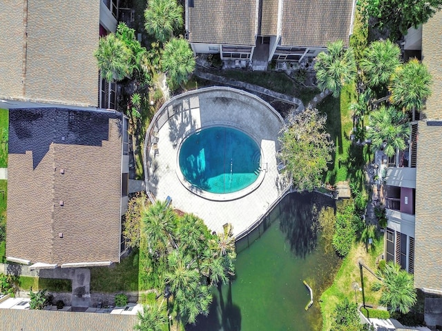 3869 S Lake Dr Unit 146, Tampa, FL 33614 - drone / aerial view of a pool and a large body of water